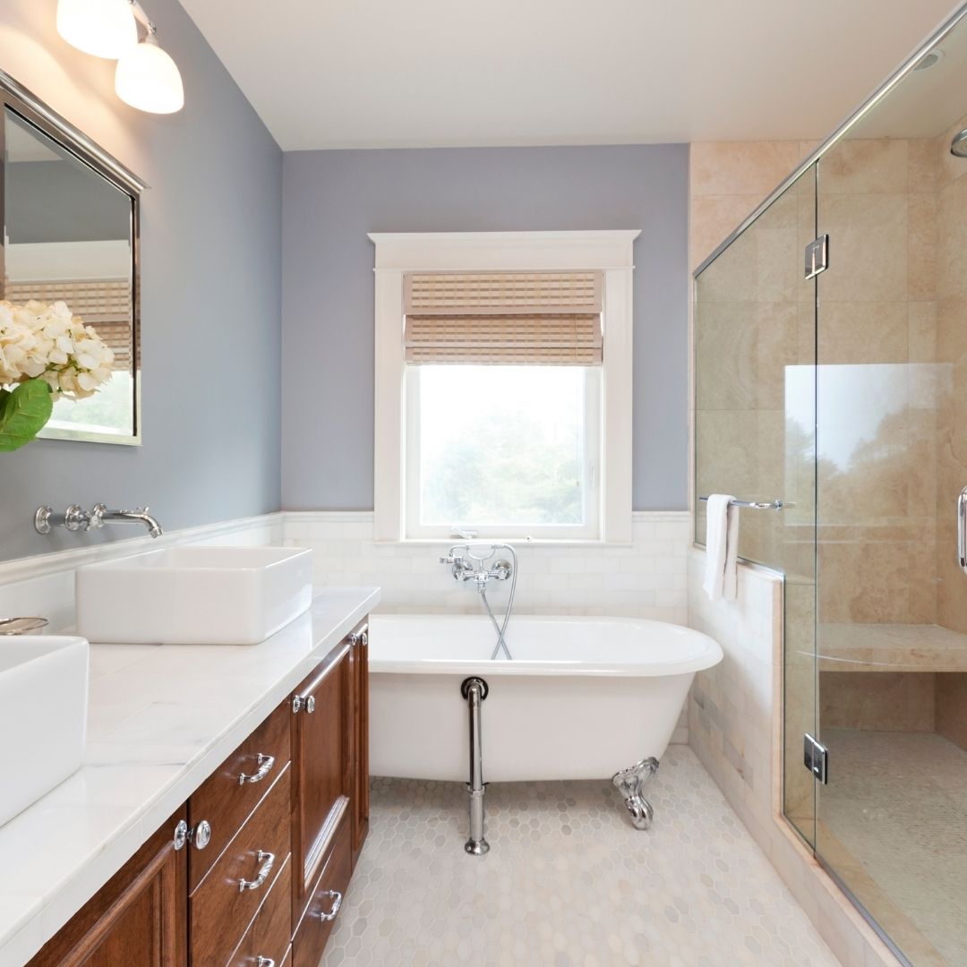 Updated bathroom with walk-in shower and claw foot tub