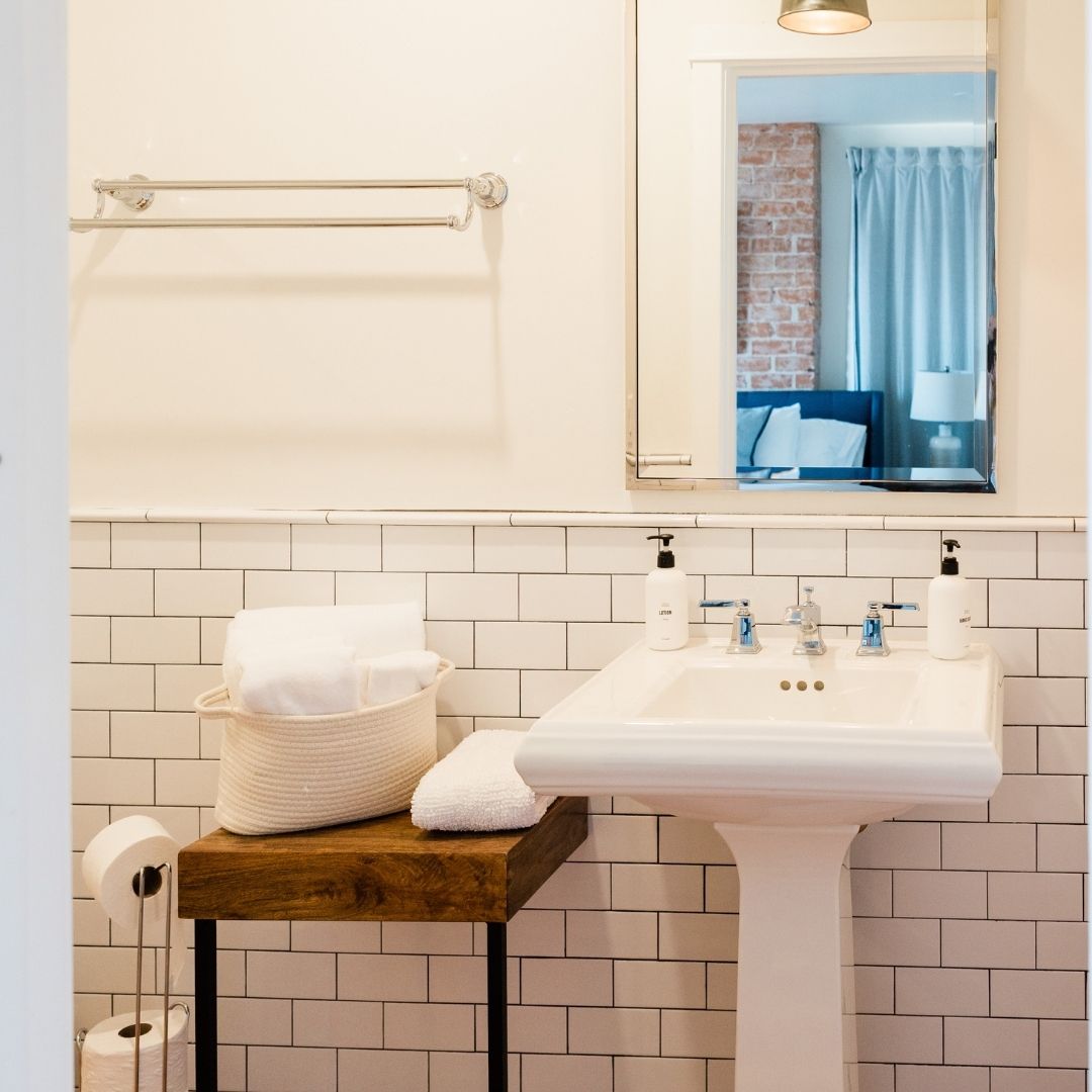 Bathroom sink with mirror above it