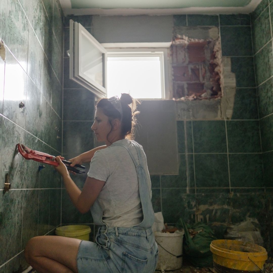 Woman working on a bathroom remodel